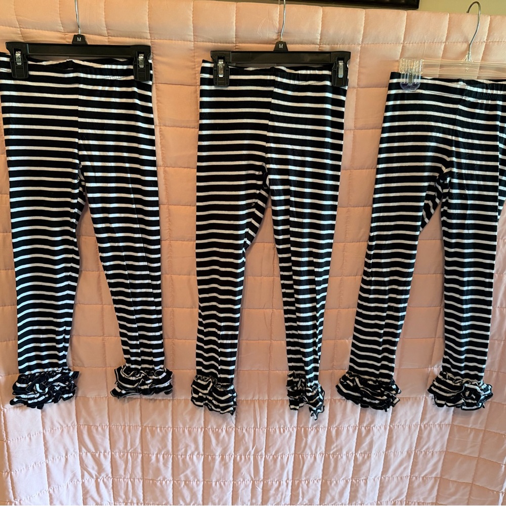 Black and White Striped Ruffle Leggings
Price for all 3. Will sell separately.